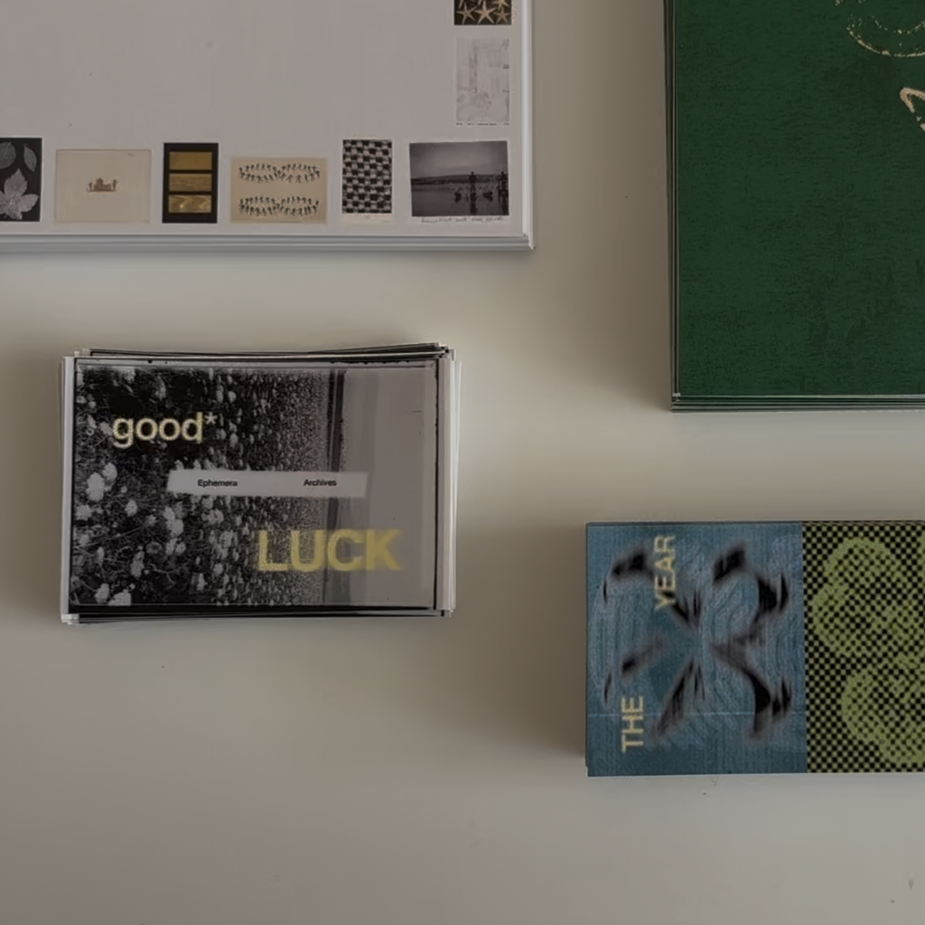 Collection of books and a cassette tape on a white surface